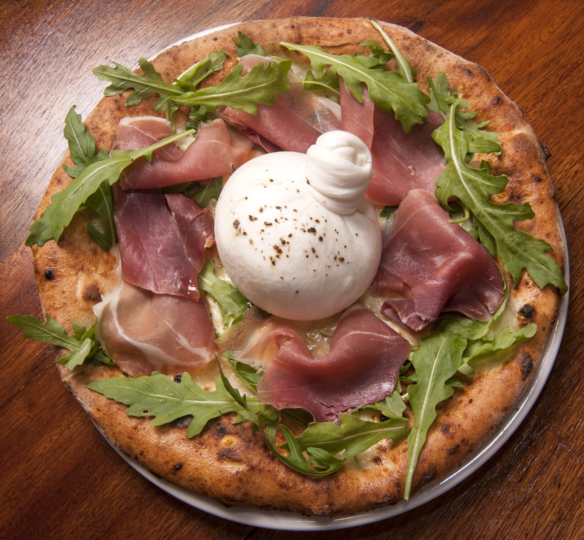 Fresh burrata over pizza